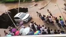 Car narrowly swallowed by sinkhole in China