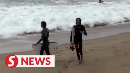 French police chase off lockdown surfers