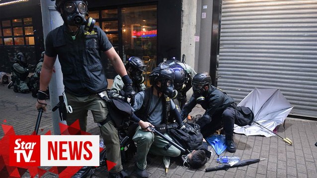 Arrests as mask ban fails to quell Hong Kong protests