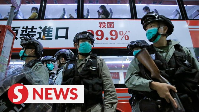 Police fire pepper spray at Hong Kong protesters