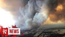 Australian authorities steer mass evacuation as wildfires raze coastal towns