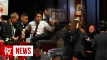 HK lawmakers dragged from chamber as leader heckled for second day