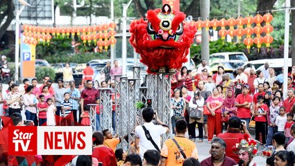 Multi-racial crowd throngs MCA's annual Chinese New Year open house