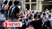 Water bottles thrown at Lebanese politician as crowd turns angry