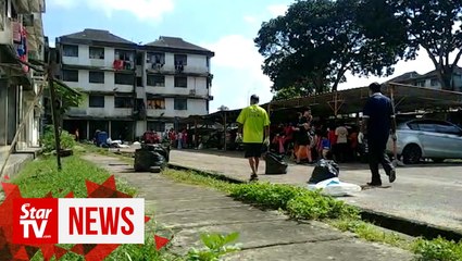 Church volunteers help clean up common areas of Taman Megah flats
