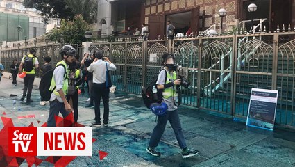 Jets of blue dye, water fired at Kowloon Mosque