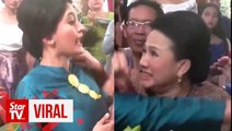 Watch two wedding guests fight over rendang