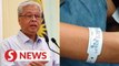 Ismail Sabri: It's an offence to remove quarantine wristbands