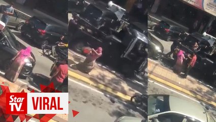 Woman shouts, spits and assaults council workers for towing her car