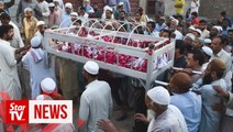 Funerals begin as town mourns victims of Pakistan train fire