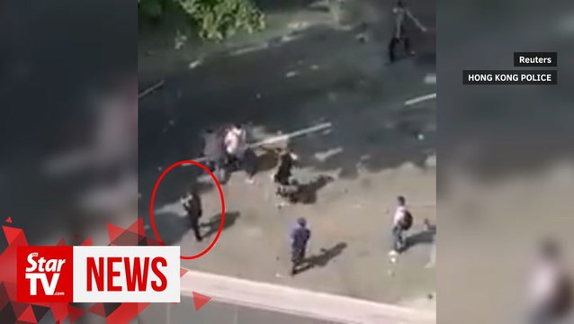 Turn yourself in, son of killed sanitation worker tells HK protester