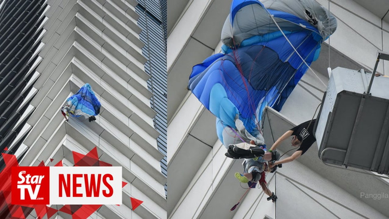 Putrajaya Base Jump participant gets stuck at side of building, brought down safely