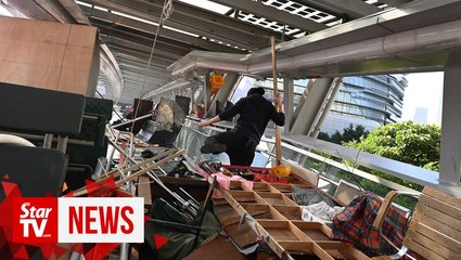 Hong Kong police urge "end by peaceful means" to university stand off