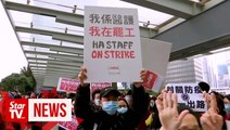 Striking Hong Kong health workers rally at government offices