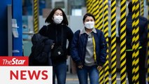Hundreds queue outside Daegu supermarket to buy face masks