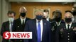 In first, Trump dons mask in visit to a military medical facility