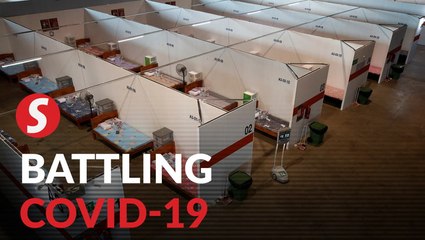 Singapore races to build beds for Covie-19 patients as cases surge