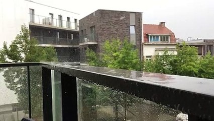Slow-motion summer rain on the balustrade