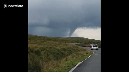 Driver spots 'tornado' swirling above Welsh countryside