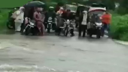 Maharashtra: Bike washes away into the river