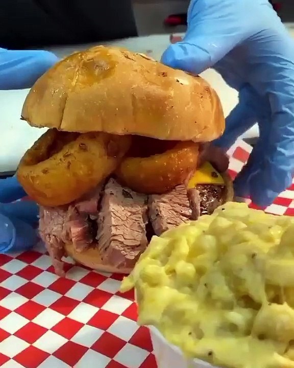 BBQ BRISKET BURGER Burger topped with cheddar, brisket, onion rings