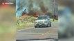 Hellish scene as brush fire flames rise alongside road in Hawaii