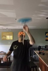 Guy With Neon Glasses Balances Spinning Plate on Stick and Finger