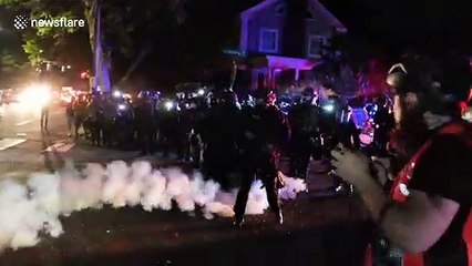 Police fire smoke bombs at protesters in Portland