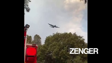 Airplane drops fire retardant chemical on Lake Fire blaze