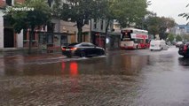 Vehicles drive through flooded streets in Cork, Ireland after Storm Ellen batters city