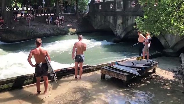 Tourists flock to unique man-made surfing spot in central Munich