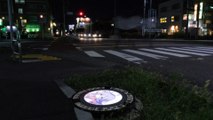 Japan city lights up manhole covers with anime characters