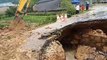 Flooding in Vietnam triggers landslides which leave roads damaged