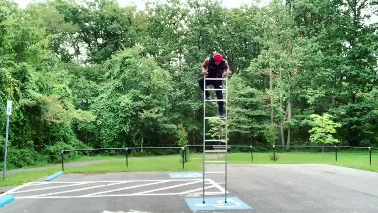 Man Does Outstanding Balancing Trick by Climbing on Top of Ladder