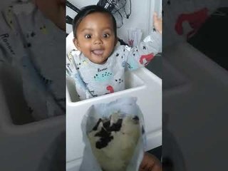 Excited Toddler Reaches For Ice-Cream