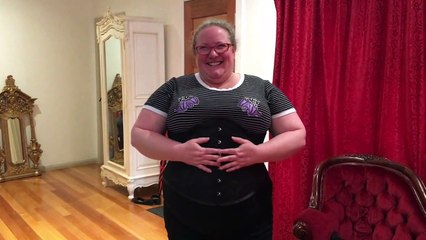 Natasha trying on her first corset