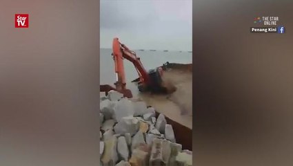 Barge overturns due to stormy winds