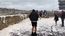 Dorset residents enjoy flying sea foam during Storm Francis