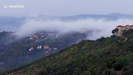Watch as cool fog cascades down from the mountains and covers Barcelona before evaporating in the city warmth