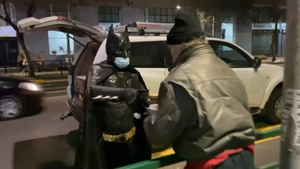 Batman Delivers Food To Homeless In Santiago