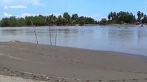 Locals cross crocodile-infested river at spot where man was killed days earlier