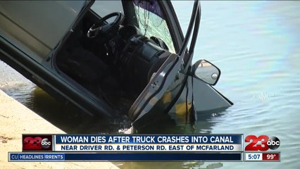 Woman dies after truck crashes into canal
