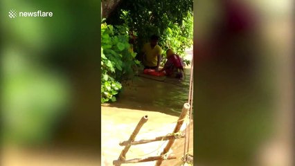 Firefighters rescue woman and her newborn from eastern India flooding
