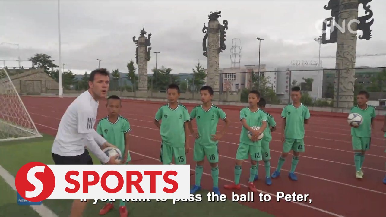 UEFA coach training kids in underdeveloped Chinese region