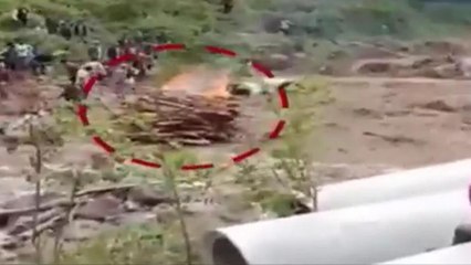 Shocking! Flood washes away burning pyre