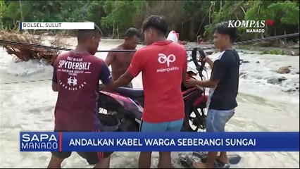 Warga Nekat Menyeberangi Sungai Menggunakan Kabel