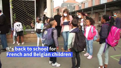 Eager children go back to school in France and Belgium