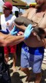 Baby Nurse Shark Latched onto Mans Arm at Beach