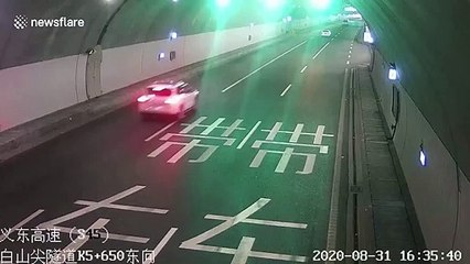 Car flips over and slides along road after crashing in eastern China
