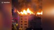 Chinese residents trapped in burning building climb seven storeys down on water pipe to escape
